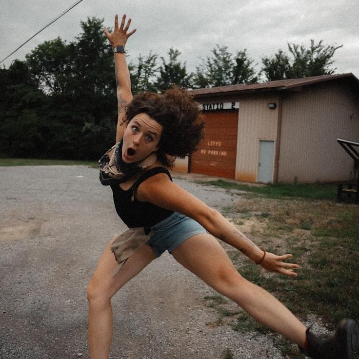 Kaveri Mehta, Lead Design Curator at HarborQuietStudio, reviewing corporate floral arrangements
